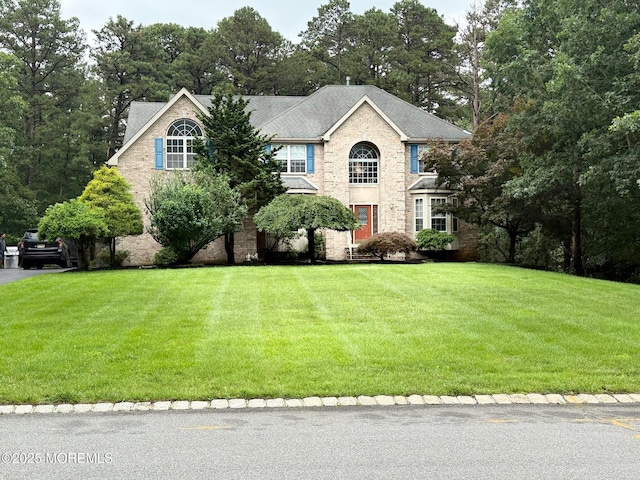67 Erin Dr, Jackson, NJ 08527 - view of front of home with a front yard and brick siding
