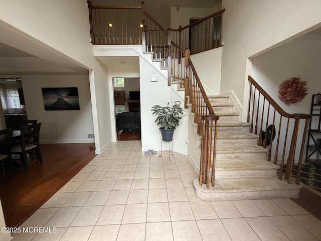 67 Erin Dr, Jackson, NJ 08527 - stairs featuring healthy amount of natural light, wood finished floors, and a towering ceiling