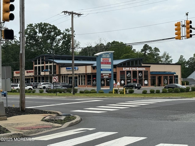 67 Erin Dr, Jackson, NJ 08527 - view of asphalt road featuring traffic lights, traffic signs, curbs, sidewalks, and street lighting