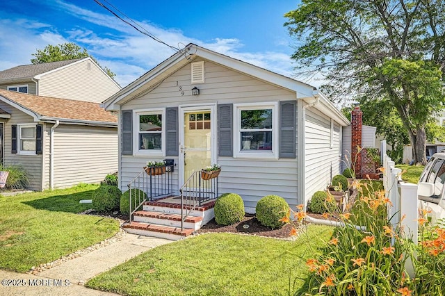 139 Seabreeze Ave, North Middletown, NJ 07748 - shotgun-style home with a front lawn