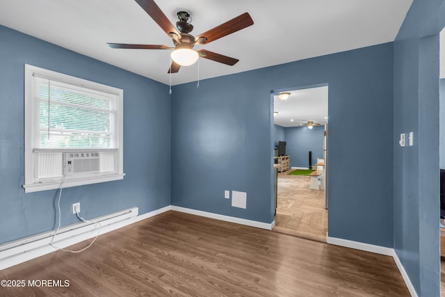 301 6th St, Waretown, NJ 08758 - empty room featuring ceiling fan, cooling unit, baseboard heating, and wood finished floors