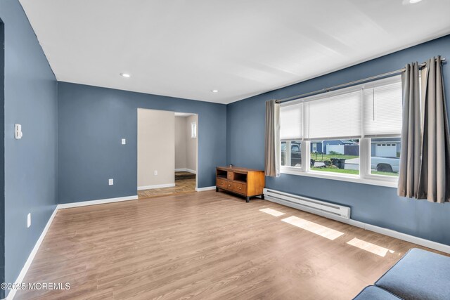 301 6th St, Waretown, NJ 08758 - unfurnished room featuring baseboard heating, wood finished floors, and recessed lighting