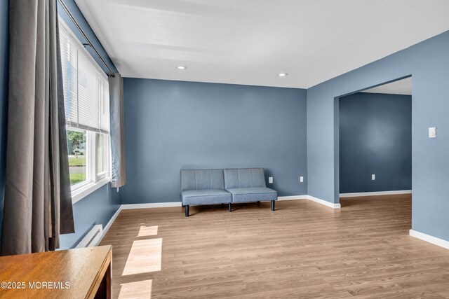 301 6th St, Waretown, NJ 08758 - sitting room with wood finished floors, recessed lighting, and baseboard heating