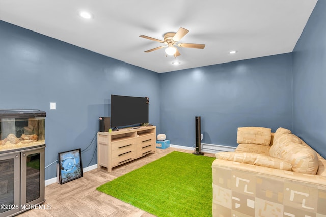 301 6th St, Waretown, NJ 08758 - living room featuring ceiling fan, a baseboard heating unit, and recessed lighting