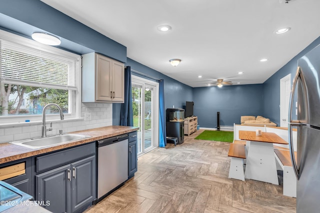 301 6th St, Waretown, NJ 08758 - kitchen featuring appliances with stainless steel finishes, recessed lighting, ceiling fan, tasteful backsplash, and light countertops