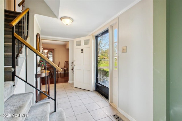23 Clinton Dr, Manalapan, NJ 07726 - foyer with stairs, light tile patterned floors, and crown molding