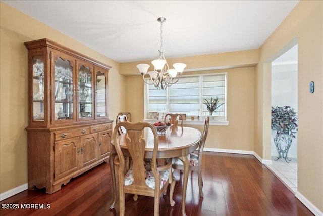 23 Clinton Dr, Manalapan, NJ 07726 - dining area with a chandelier, dark wood-style flooring, and healthy amount of natural light