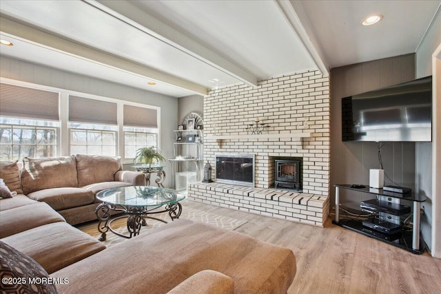 23 Clinton Dr, Manalapan, NJ 07726 - living room with wood finished floors, a brick fireplace, beamed ceiling, and recessed lighting