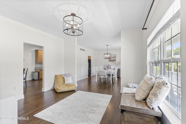 6 Kindling Way, Jackson, NJ 08527 - living room with a chandelier, dark wood-style flooring, and wainscoting