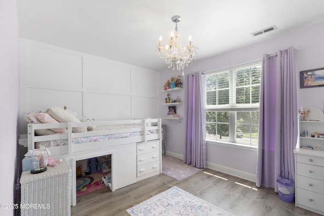 6 Kindling Way, Jackson, NJ 08527 - bedroom with a chandelier and light wood-style flooring
