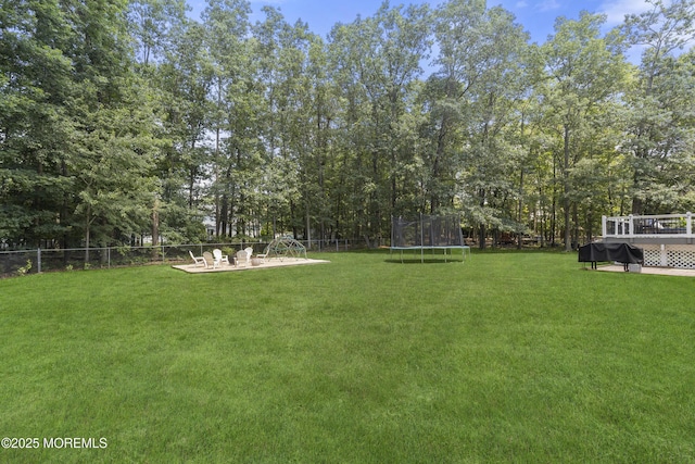 6 Kindling Way, Jackson, NJ 08527 - view of yard featuring a trampoline, a deck, and a patio