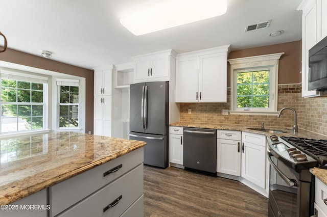 31 Strawberry Ln, Lakewood, NJ 08701 - kitchen featuring black appliances, dark wood-style floors, tasteful backsplash, and white cabinets