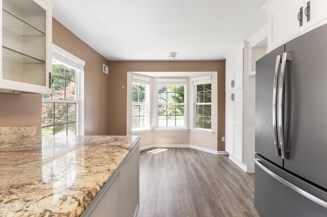 31 Strawberry Ln, Lakewood, NJ 08701 - kitchen featuring freestanding refrigerator, wood finished floors, glass insert cabinets, light stone counters, and white cabinets