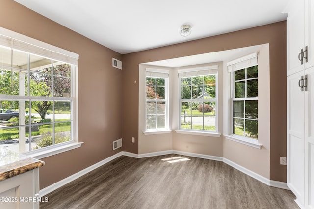 31 Strawberry Ln, Lakewood, NJ 08701 - spare room with wood finished floors and plenty of natural light