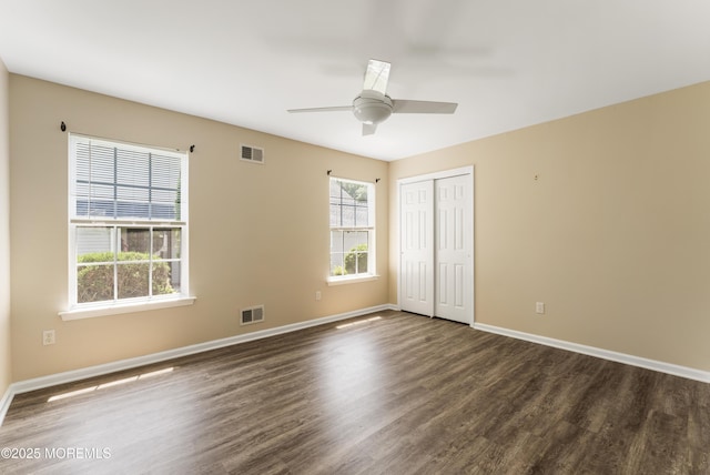 31 Strawberry Ln, Lakewood, NJ 08701 - unfurnished bedroom featuring dark wood-style floors, a closet, and a ceiling fan