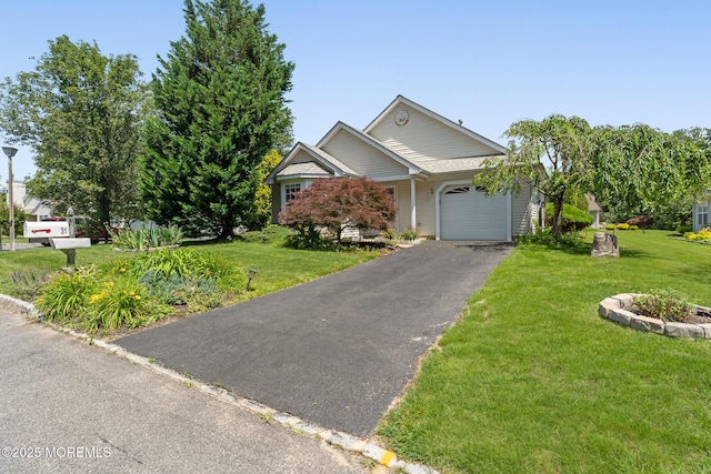 31 Strawberry Ln, Lakewood, NJ 08701 - view of front of property with an attached garage, asphalt driveway, and a front lawn