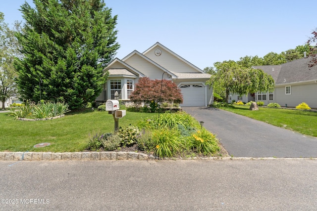 31 Strawberry Ln, Lakewood, NJ 08701 - view of front facade featuring an attached garage, driveway, and a front yard