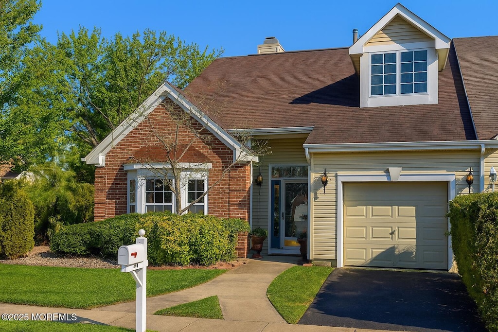 49 Butler Ave, Bayville, NJ 08721 - view of front facade with a chimney, asphalt driveway, brick siding, and a shingled roof