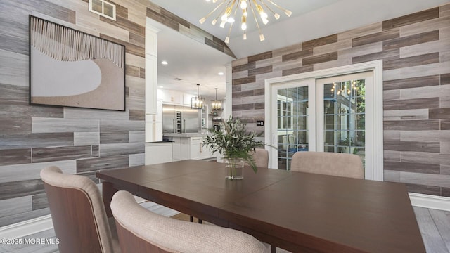 9 Withers Ln, Atlantic Highlands, NJ 07716 - dining area with a chandelier, tile walls, and wood finished floors