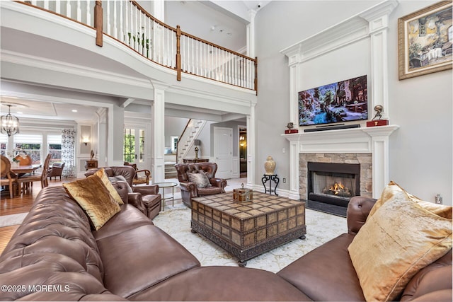 9 Withers Ln, Atlantic Highlands, NJ 07716 - living area featuring a towering ceiling, a stone fireplace, decorative columns, and crown molding
