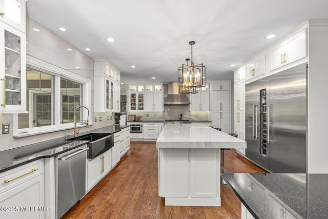9 Withers Ln, Atlantic Highlands, NJ 07716 - kitchen featuring stainless steel appliances, wall chimney exhaust hood, white cabinetry, a center island, and recessed lighting