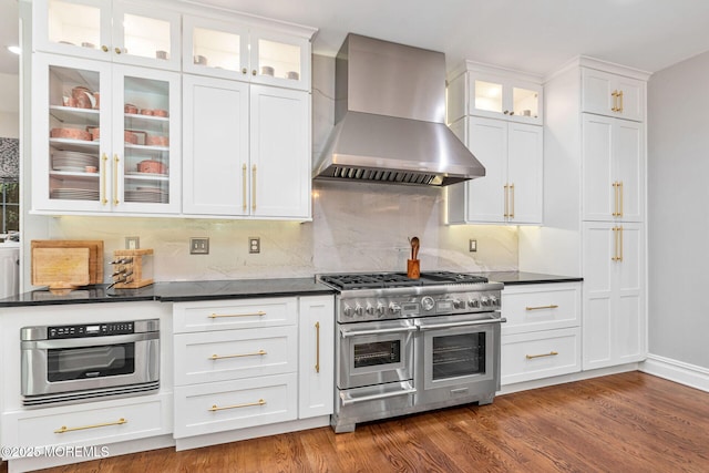 9 Withers Ln, Atlantic Highlands, NJ 07716 - kitchen with wall chimney exhaust hood, range with two ovens, dark countertops, and white cabinets