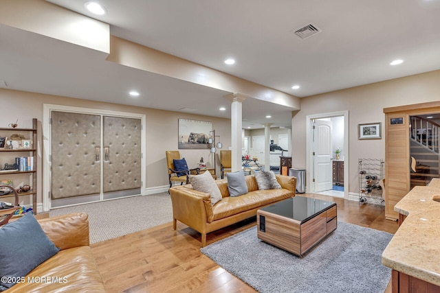 9 Withers Ln, Atlantic Highlands, NJ 07716 - living area with decorative columns, light wood finished floors, and recessed lighting
