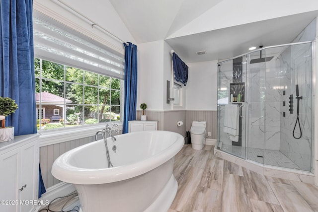 9 Withers Ln, Atlantic Highlands, NJ 07716 - full bathroom featuring a freestanding bath, a marble finish shower, a wainscoted wall, vaulted ceiling, and wood finished floors