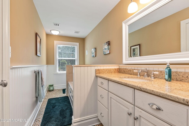 9 Withers Ln, Atlantic Highlands, NJ 07716 - full bath featuring wainscoting, vanity, and a tub