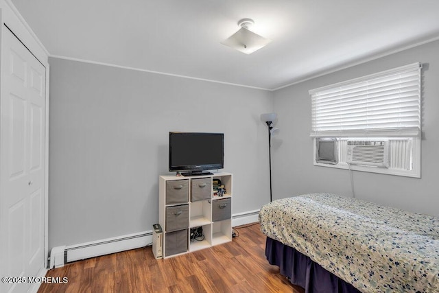 99 Roosevelt Cir E, Red Bank, NJ 07701 - bedroom featuring a baseboard heating unit, wood finished floors, cooling unit, and crown molding