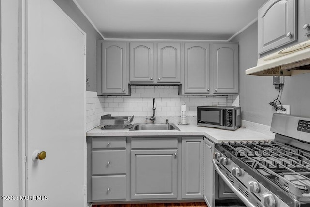 99 Roosevelt Cir E, Red Bank, NJ 07701 - kitchen featuring stainless steel gas stove, gray cabinetry, decorative backsplash, and light countertops
