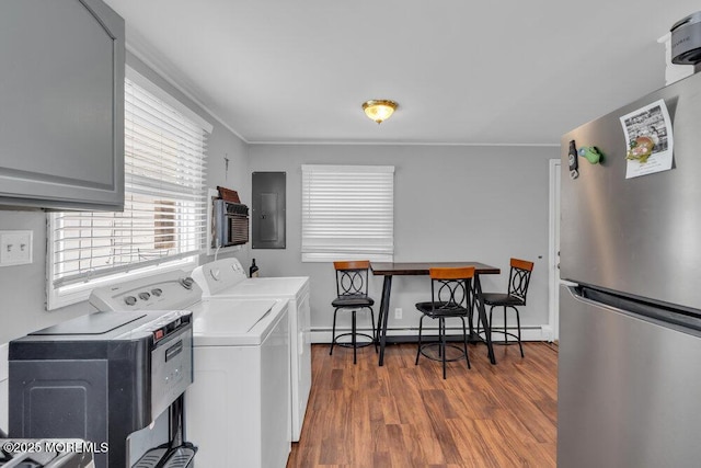 99 Roosevelt Cir E, Red Bank, NJ 07701 - laundry area with electric panel, separate washer and dryer, dark wood-style floors, crown molding, and a baseboard radiator