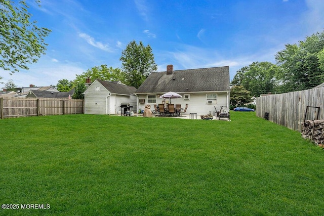 99 Roosevelt Cir E, Red Bank, NJ 07701 - back of house with a fenced backyard, a patio, a shed, and a chimney