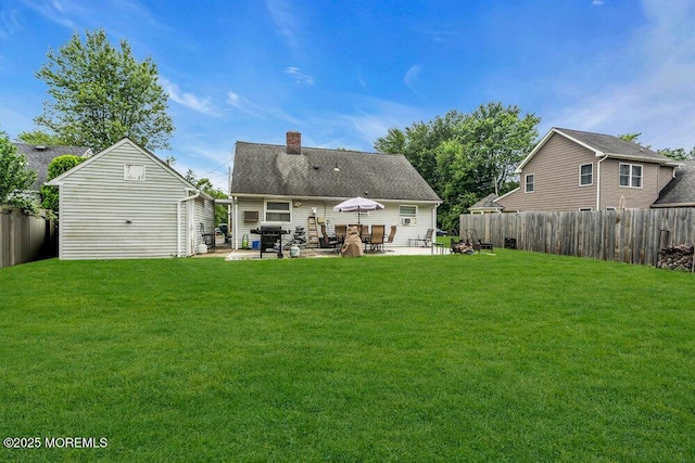 99 Roosevelt Cir E, Red Bank, NJ 07701 - rear view of house with a patio area, a chimney, and a fenced backyard