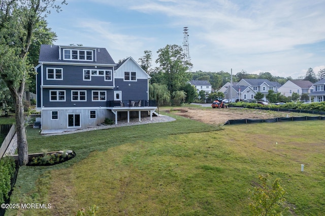 515 Atlantic Ave, Middletown, NJ 07748 - back of house featuring a residential view, a wooden deck, and a lawn