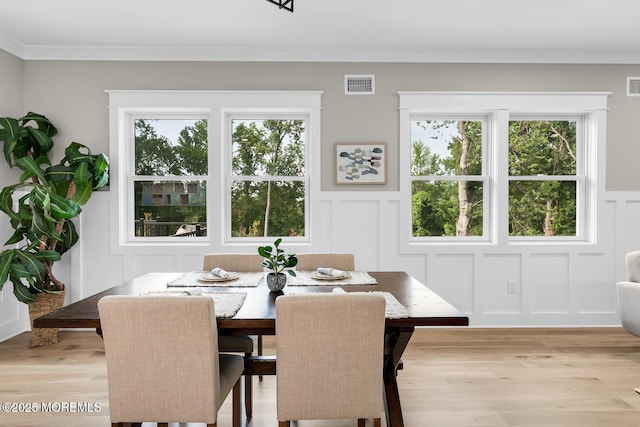 515 Atlantic Ave, Middletown, NJ 07748 - dining room with a decorative wall, light wood-style floors, ornamental molding, and a wainscoted wall