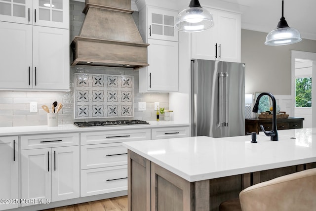 515 Atlantic Ave, Middletown, NJ 07748 - kitchen featuring appliances with stainless steel finishes, custom exhaust hood, light countertops, and decorative light fixtures