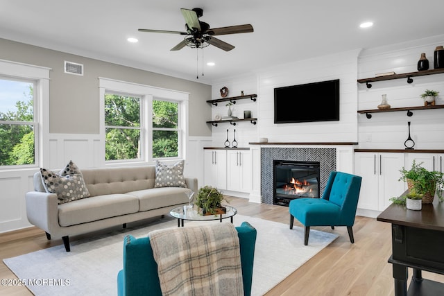 515 Atlantic Ave, Middletown, NJ 07748 - living area featuring light wood-style flooring, a fireplace, a ceiling fan, a decorative wall, and recessed lighting
