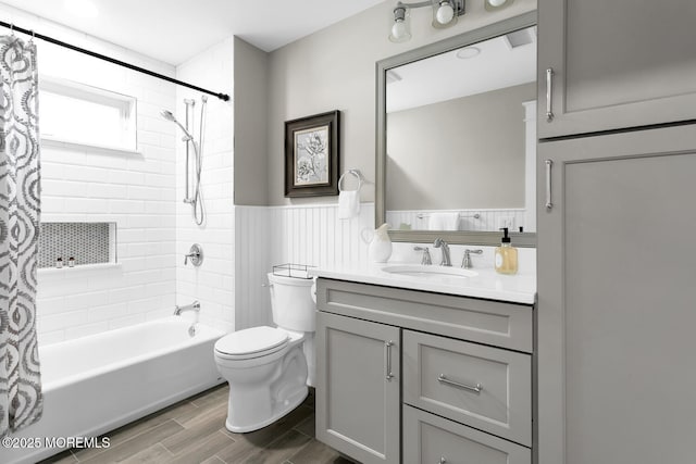 515 Atlantic Ave, Middletown, NJ 07748 - bathroom featuring shower / bathtub combination with curtain, vanity, a wainscoted wall, and wood finished floors