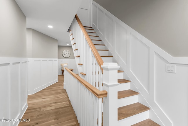 515 Atlantic Ave, Middletown, NJ 07748 - staircase with a wainscoted wall, wood finished floors, a decorative wall, and recessed lighting