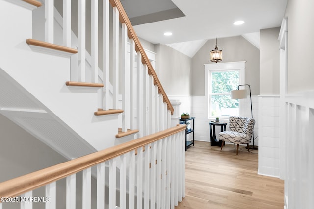 515 Atlantic Ave, Middletown, NJ 07748 - stairway featuring wood finished floors, wainscoting, recessed lighting, vaulted ceiling, and a chandelier