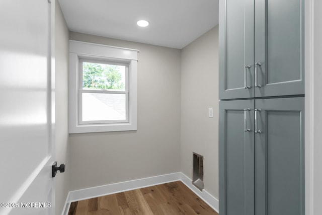 515 Atlantic Ave, Middletown, NJ 07748 - laundry room featuring cabinet space, dark wood finished floors, and recessed lighting