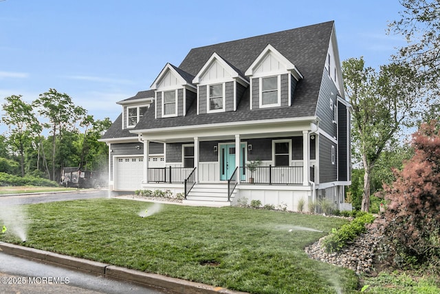 515 Atlantic Ave, Middletown, NJ 07748 - view of front of house with covered porch, a shingled roof, driveway, and a front lawn