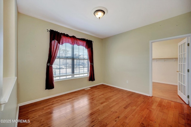 4 Nautic Way, Little Egg Harbor, NJ 08087 - unfurnished bedroom featuring light wood-style flooring, a closet, and a walk in closet
