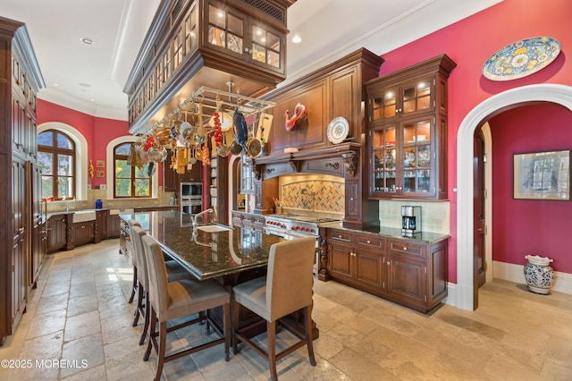 318 Rte 537, Colts Neck, NJ 07722 - dining space with stone tile floors, arched walkways, crown molding, and recessed lighting