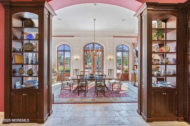 318 Rte 537, Colts Neck, NJ 07722 - dining room featuring arched walkways, stone tile flooring, and a chandelier