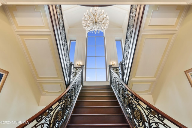 318 Rte 537, Colts Neck, NJ 07722 - stairway with a chandelier, crown molding, and a towering ceiling