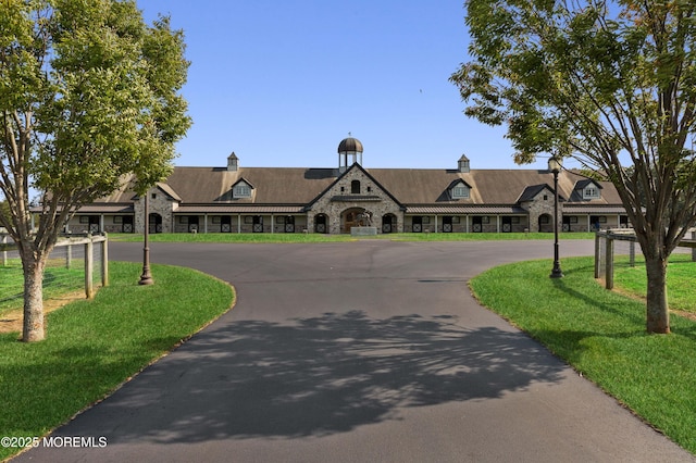 318 Rte 537, Colts Neck, NJ 07722 - view of front of home featuring stone siding, curved driveway, and a front lawn