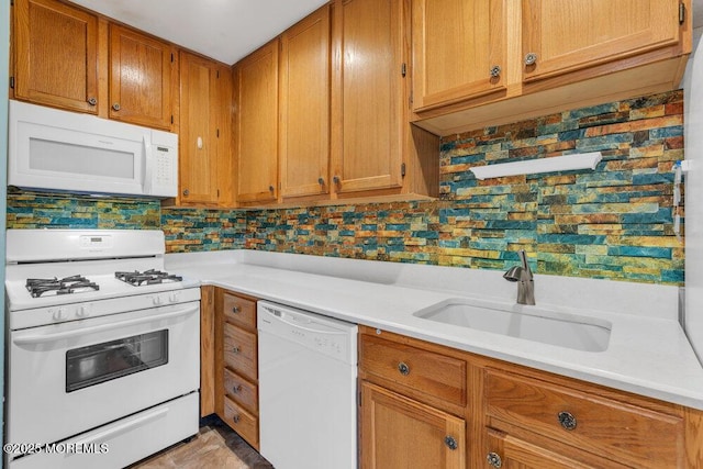 4511 Birchwood Ct, North Brunswick, NJ 08902 - kitchen with white appliances, light countertops, brown cabinetry, and tasteful backsplash