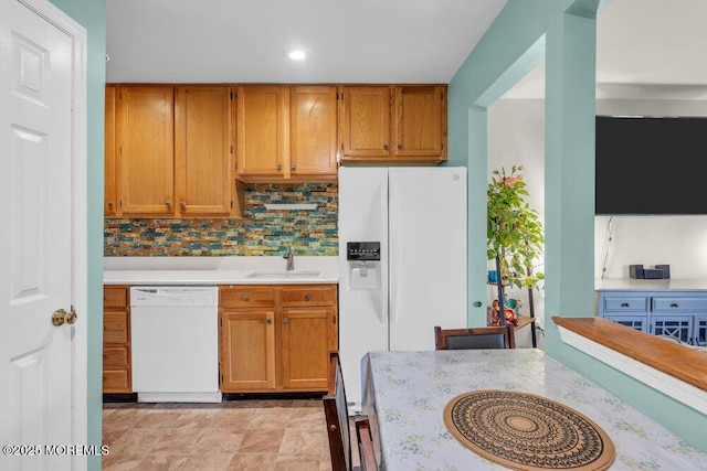 4511 Birchwood Ct, North Brunswick, NJ 08902 - kitchen with white appliances, light countertops, tasteful backsplash, brown cabinetry, and recessed lighting